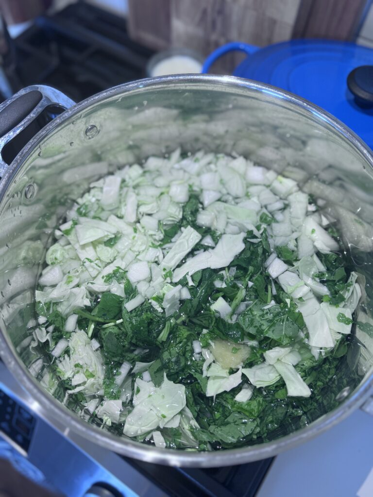 Place the greens in the pot to boil.