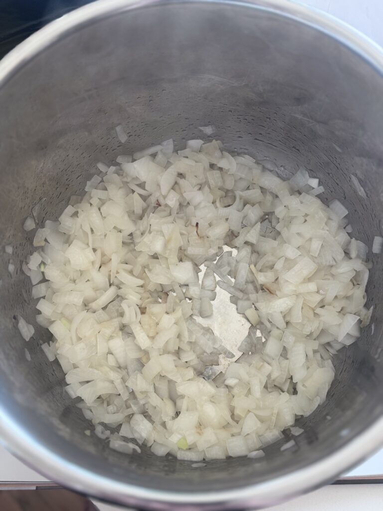 Set your Instant Pot on saute high or use a skillet over medium heat. Add 1-2 tablespoons oil, then saute the onions until golden and translucent, about 6-8 minutes.