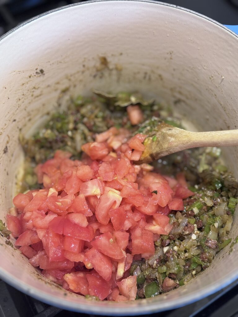 Add the peeled and chopped tomatoes, cooking until tender, about 5-8 minutes. Stir frequently to prevent sticking.