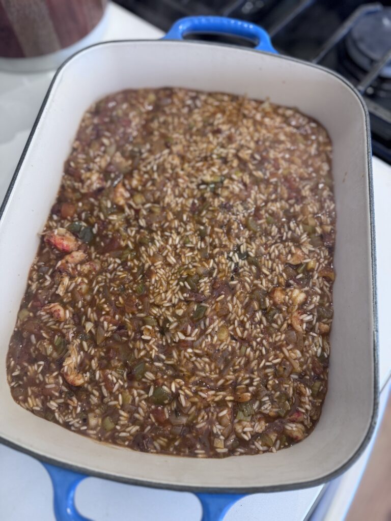 Transfer the mixture to an ungreased 8x8-inch baking pan. Cover the pan tightly with foil and bake in a preheated oven at 350°F for about 40 minutes. The rice should be tender but slightly crunchy.