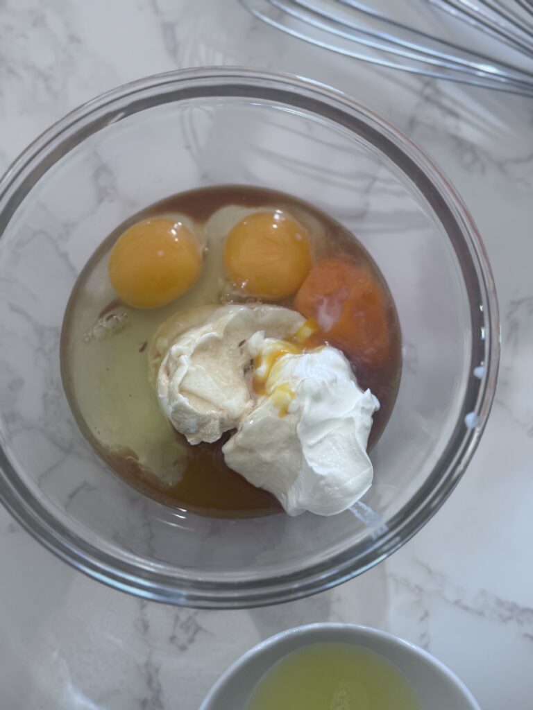 2. Combine Wet Ingredients:

In a small bowl, whisk together ½ cup plain sour cream, 1 teaspoon vanilla extract, 2 large eggs, and 1 large egg yolk. Add this mixture to the yeast mixture and beat at low speed for 1 minute until combined.