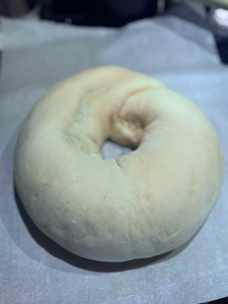 4. Shape the Cake:

Starting from one short side, roll the dough tightly into a log. Pinch the seams to seal. Form the log into a ring and pinch the ends together to seal. Place the ring seam-side down on the prepared baking sheet.

5. Second Rise:

Cover the ring with a clean kitchen towel and let it rise in a warm, draft-free place (about 75℉) for 45 minutes, or until doubled in size.